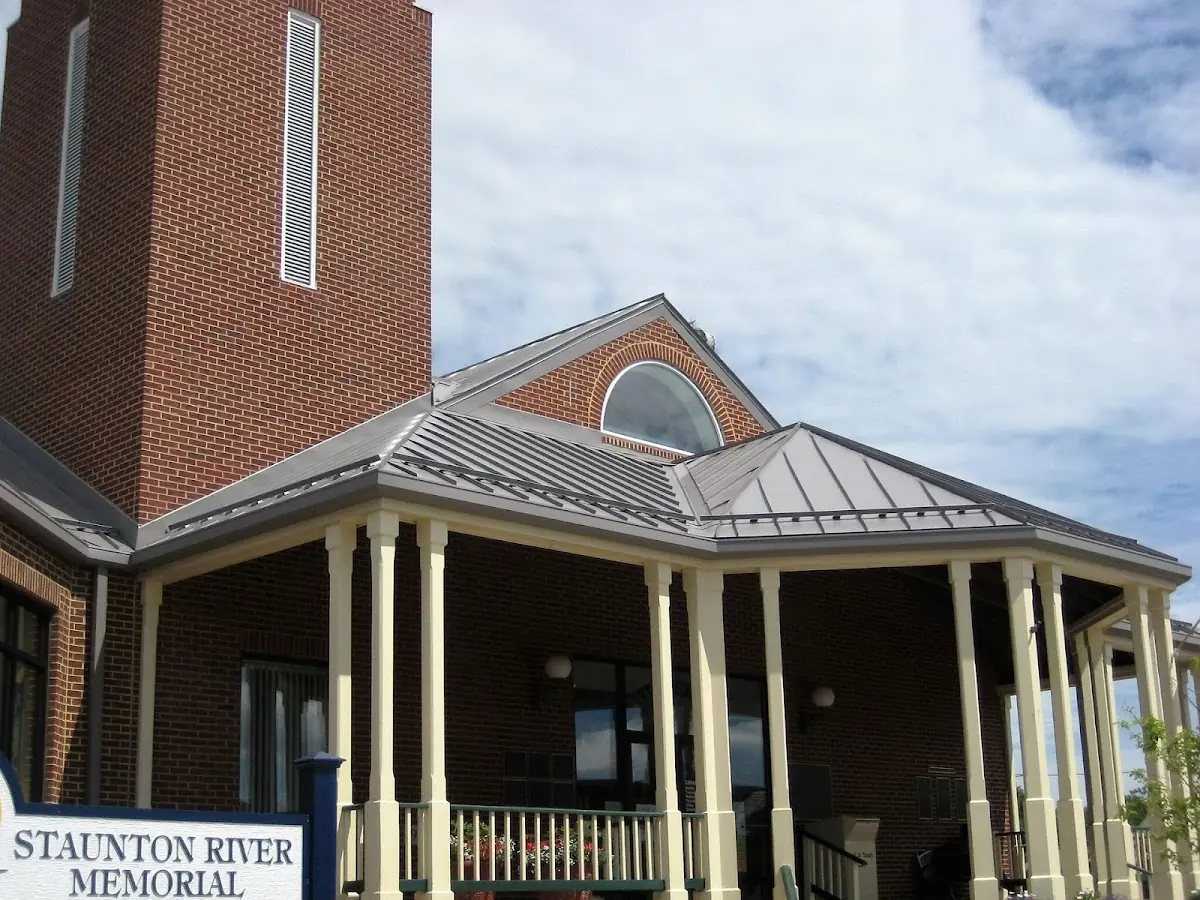 Skilled roofing craftsmen working on a residential roof in Coupon